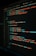 A close-up view of a computer screen displaying HTML and CSS code for a login form. The code includes elements like head, body, various input fields for username and password, and linked style sheets. The text is primarily in blue, white, orange, and green, set against a dark background.