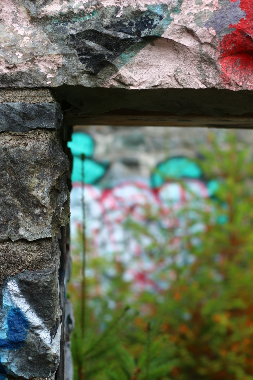 a close up of a brick wall with graffiti on it