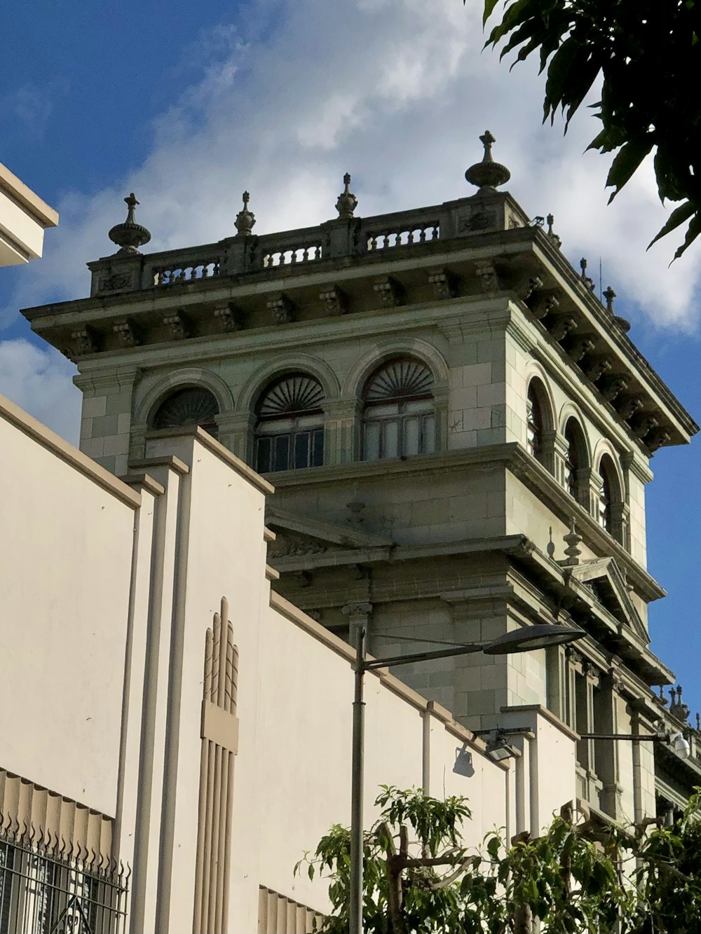 a tall building with a clock on the top of it