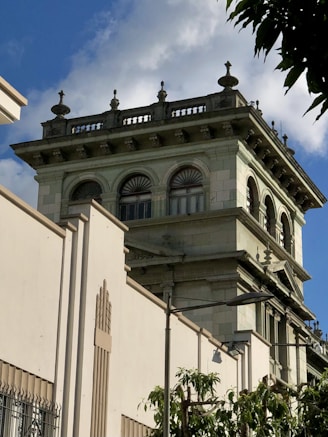 a tall building with a clock on the top of it