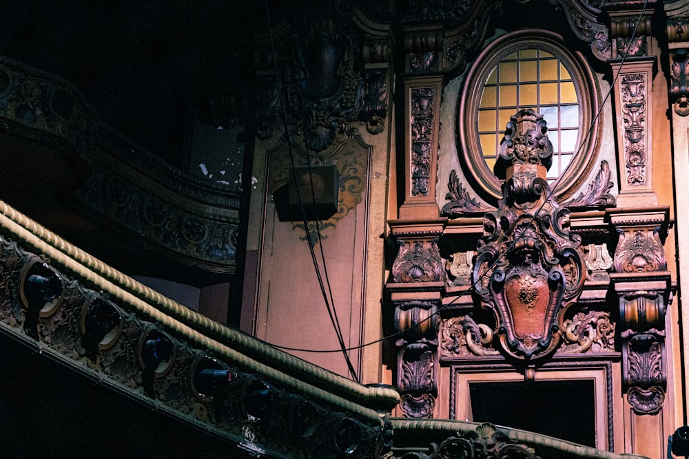 an ornate doorway with a clock on the wall