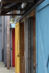 A variety of stylish doors displayed in a workshop setting.