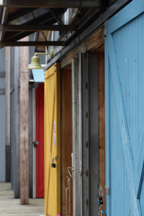 Series of doors lined up in a showroom, highlighting variety and craftsmanship.