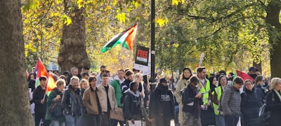 A group of diverse Ohio voters gathering signatures on a petition outdoors.