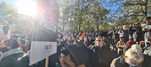 Community members gathered in a park for a public awareness event.