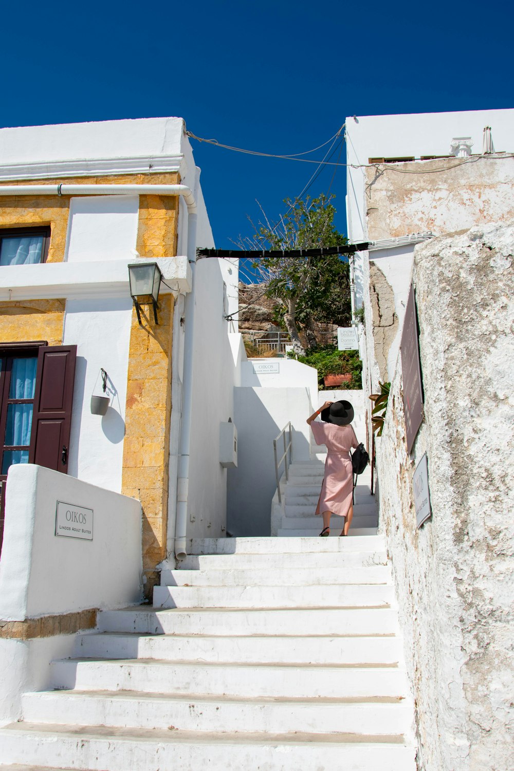 a woman walking down a set of stairs