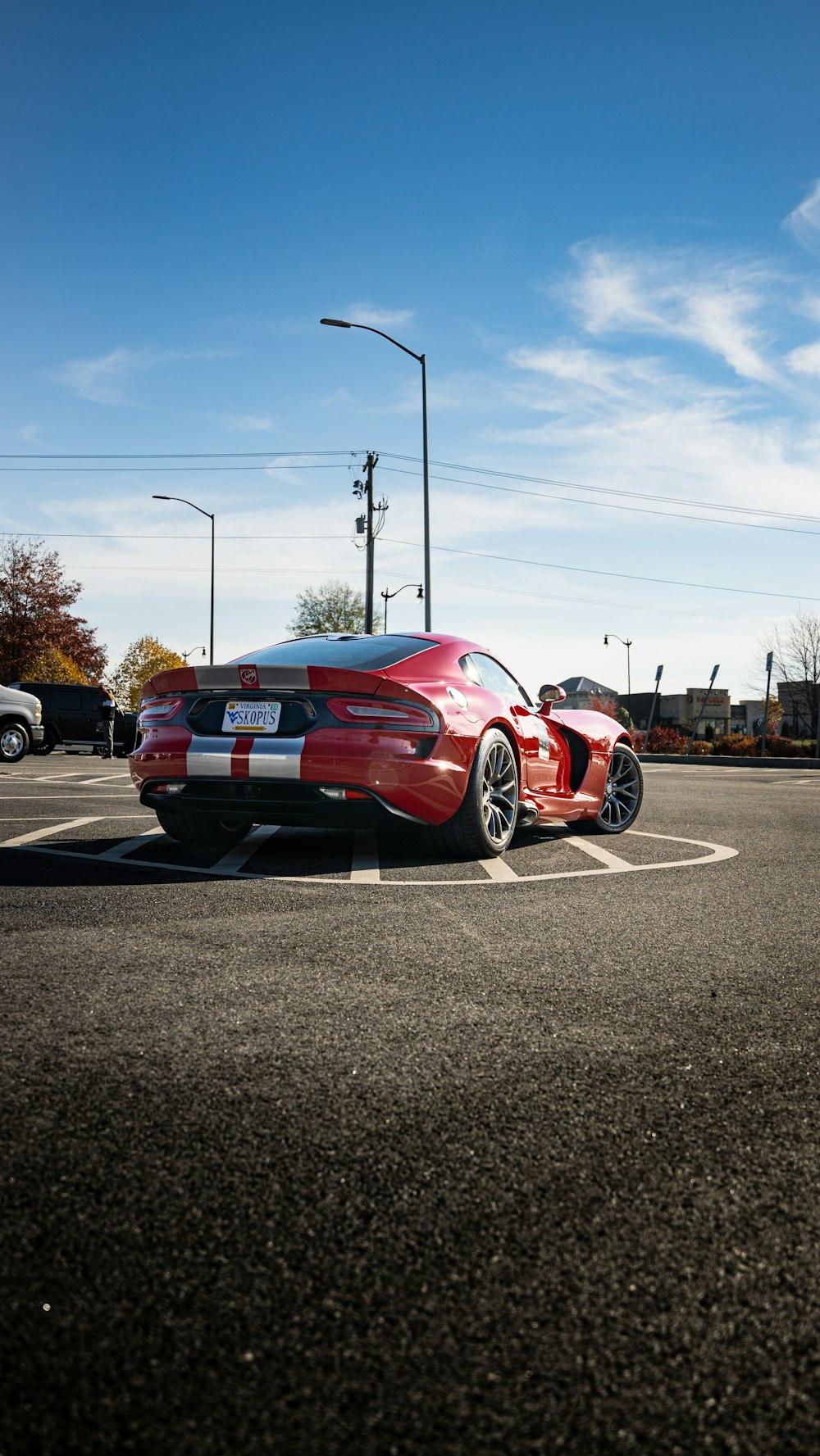 a red sports car parked in a parking lot