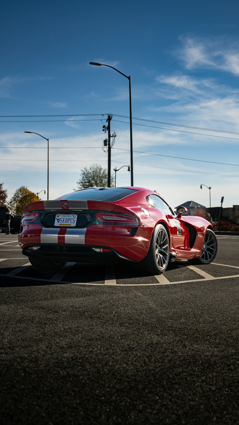 a red sports car parked in a parking lot