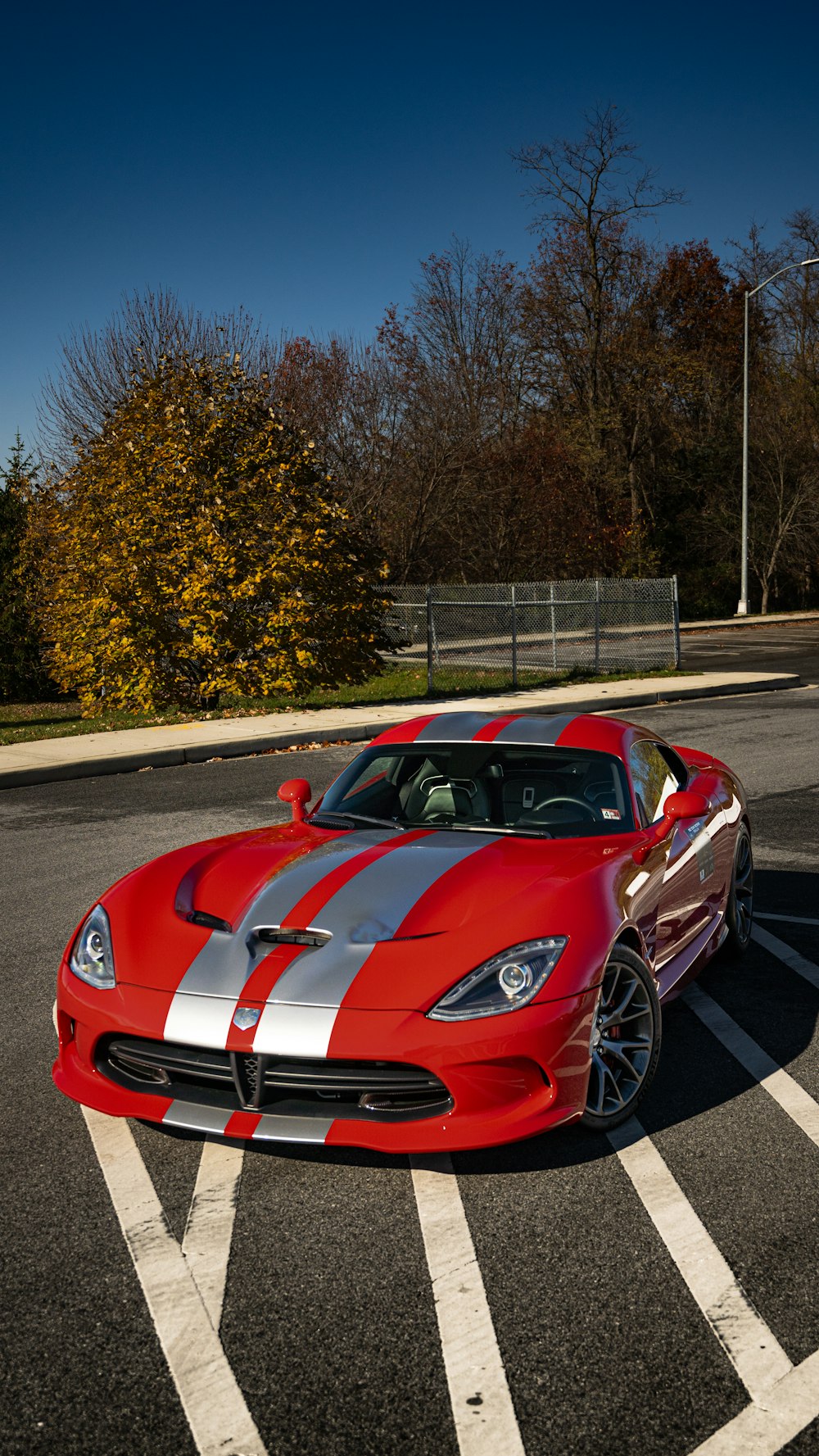 a red sports car parked in a parking lot