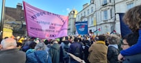 Teachers holding banners during a peaceful demonstration advocating for education rights.