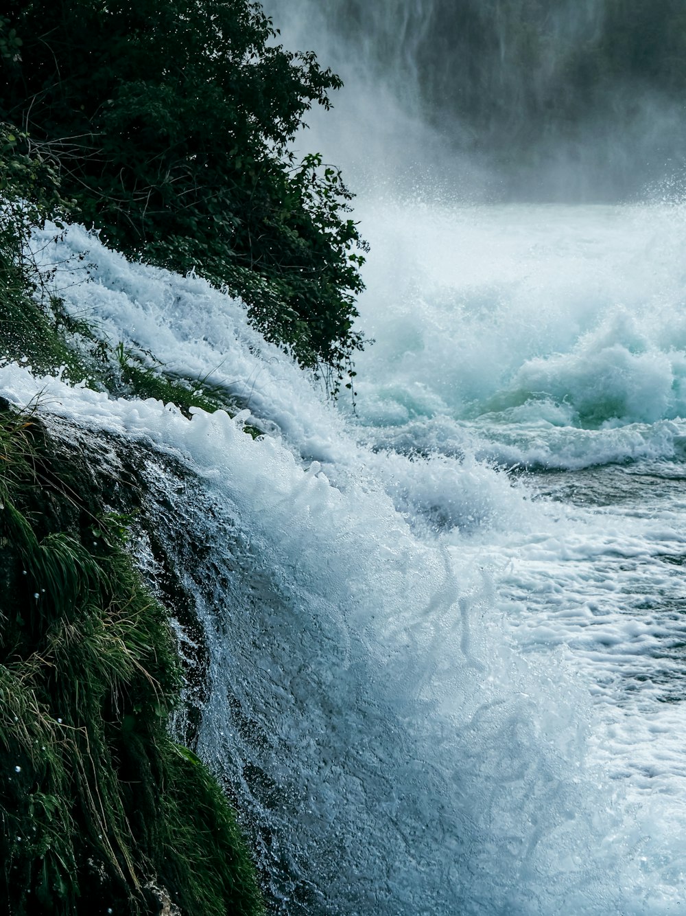 a waterfall with a large amount of water coming out of it