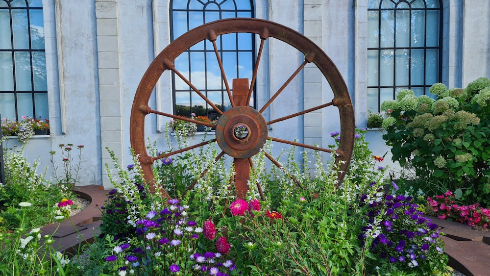 a garden with a large wheel in the middle of it