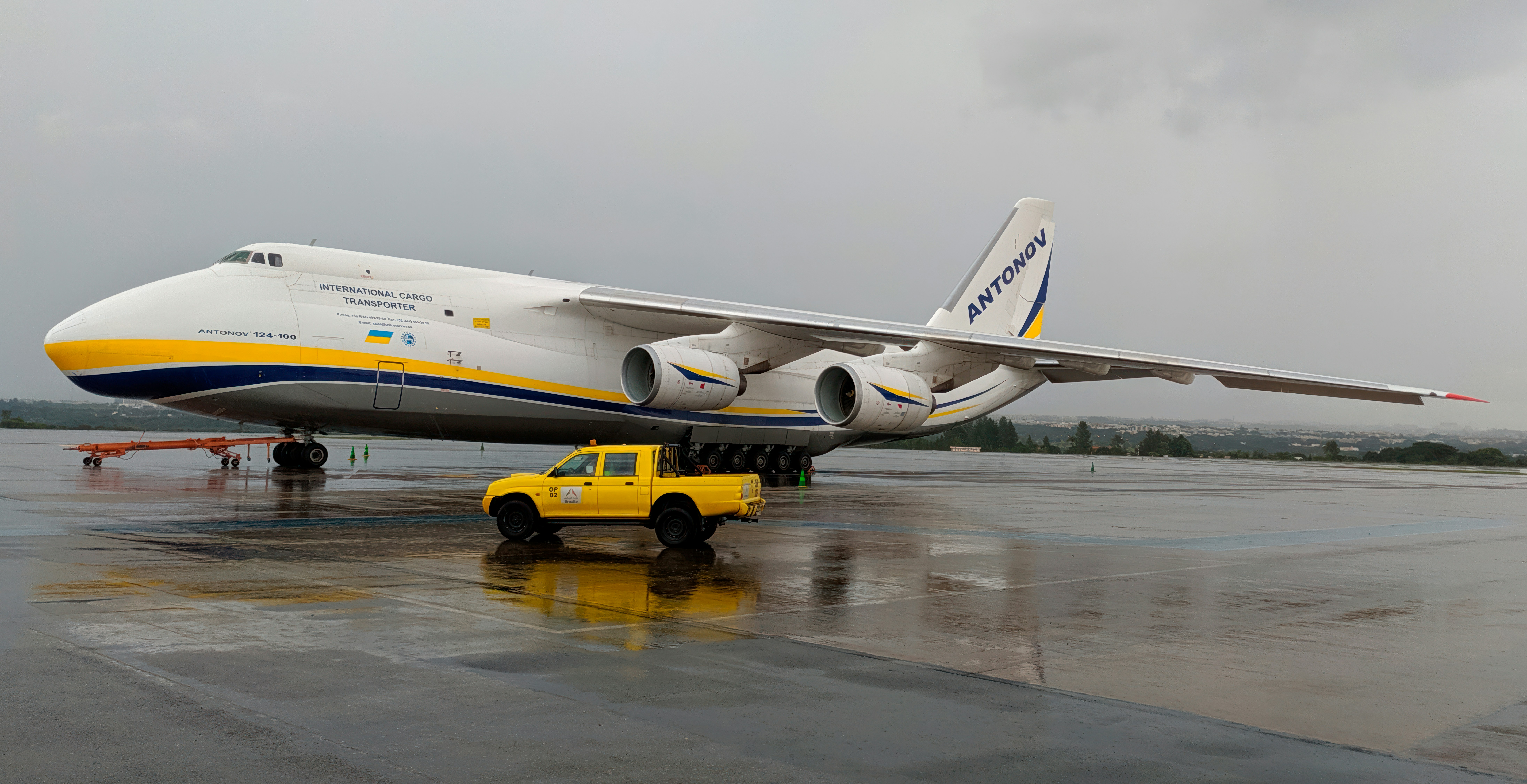 a large jetliner sitting on top of an airport tarmac, 