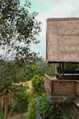 a thatched roof on top of a wooden structure