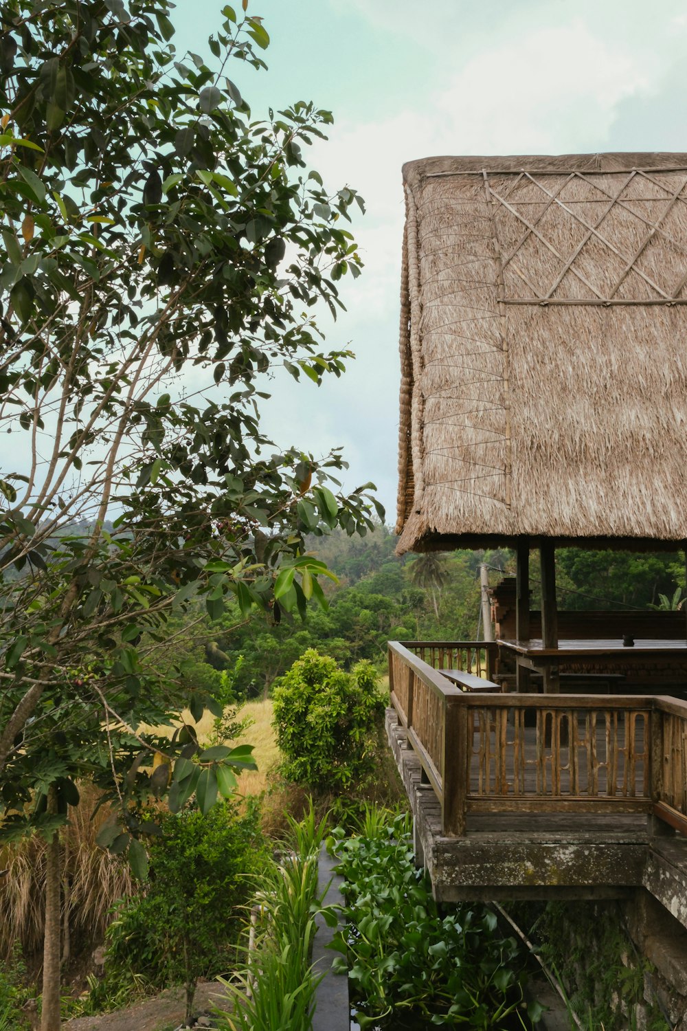 a thatched roof on top of a wooden structure