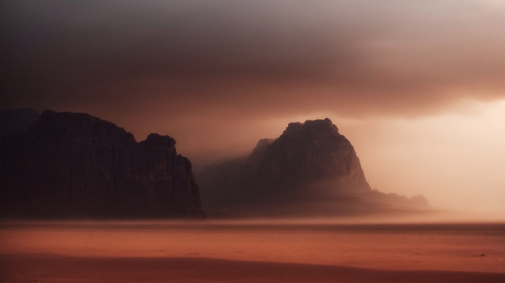 a large rock formation in the middle of a desert