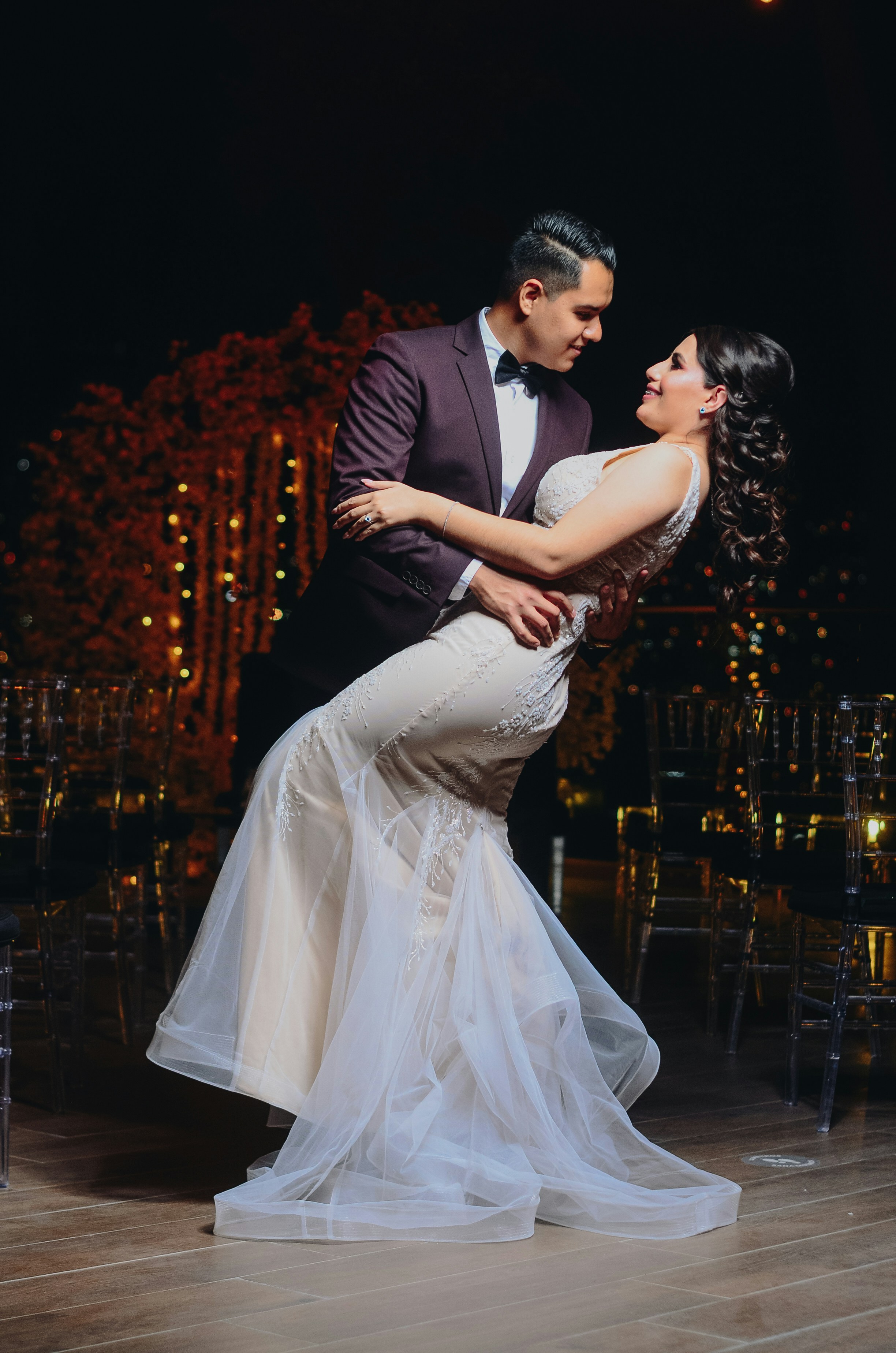 a man and a woman dance on a dance floor