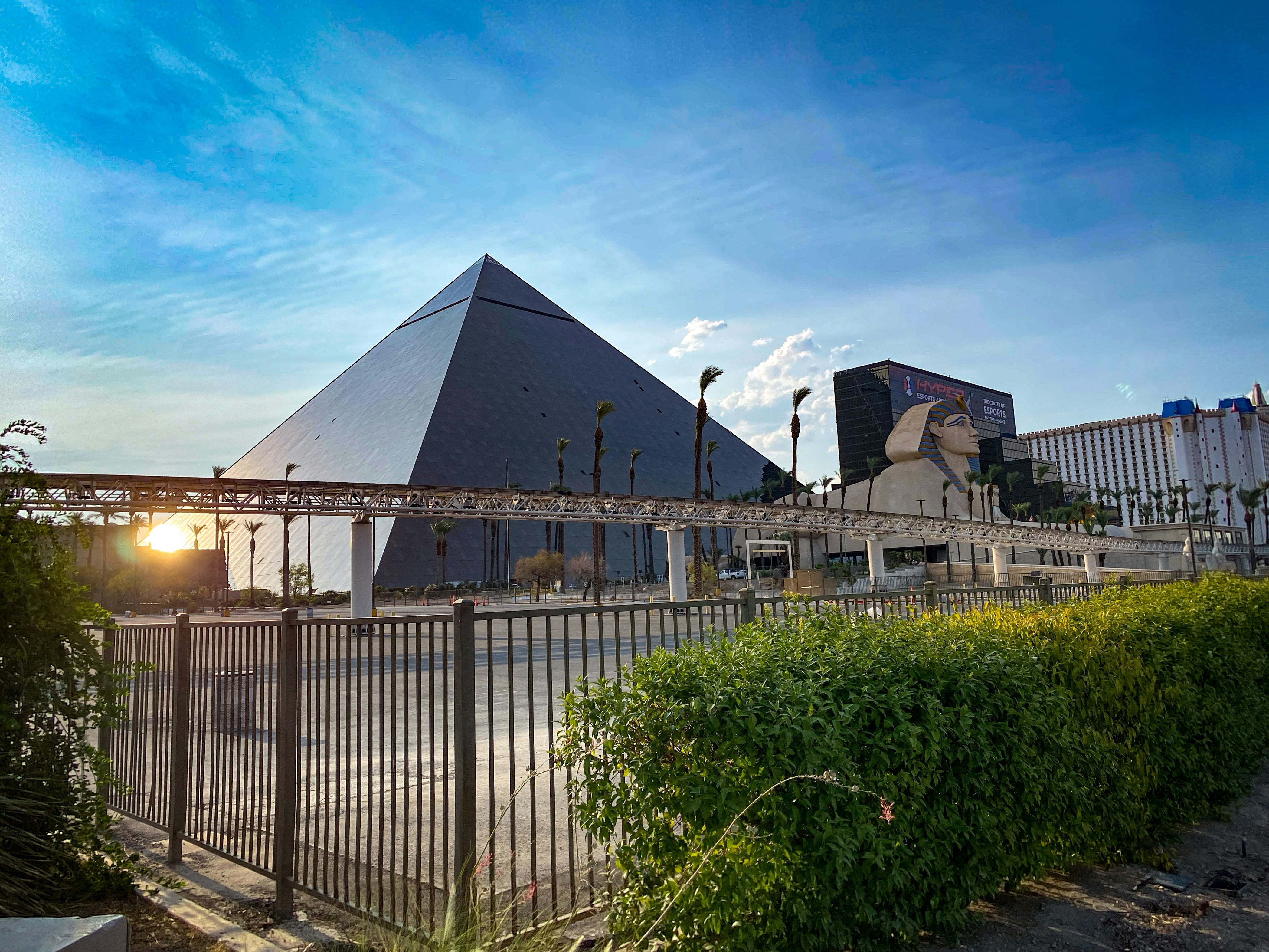 a large building with a pyramid in the background