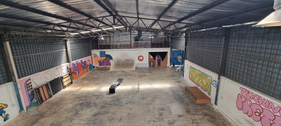 a skateboard park with graffiti on the walls