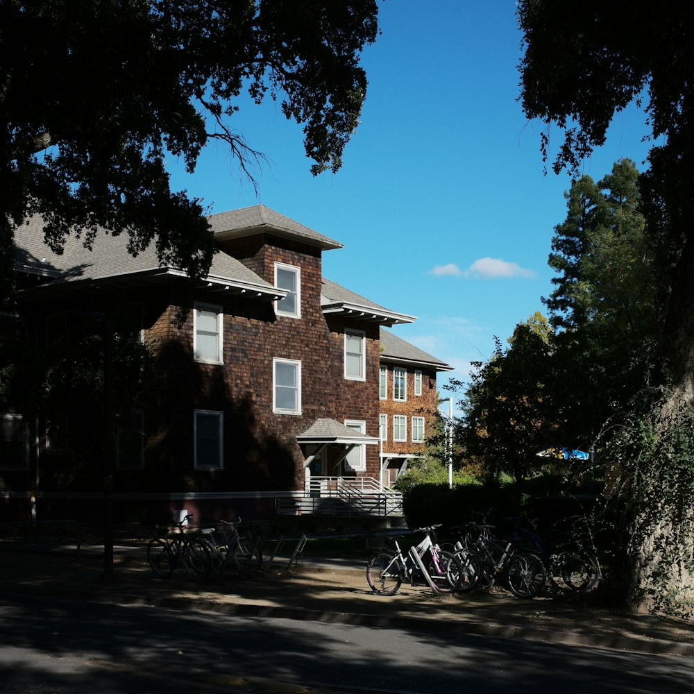 a group of bikes parked in front of a house