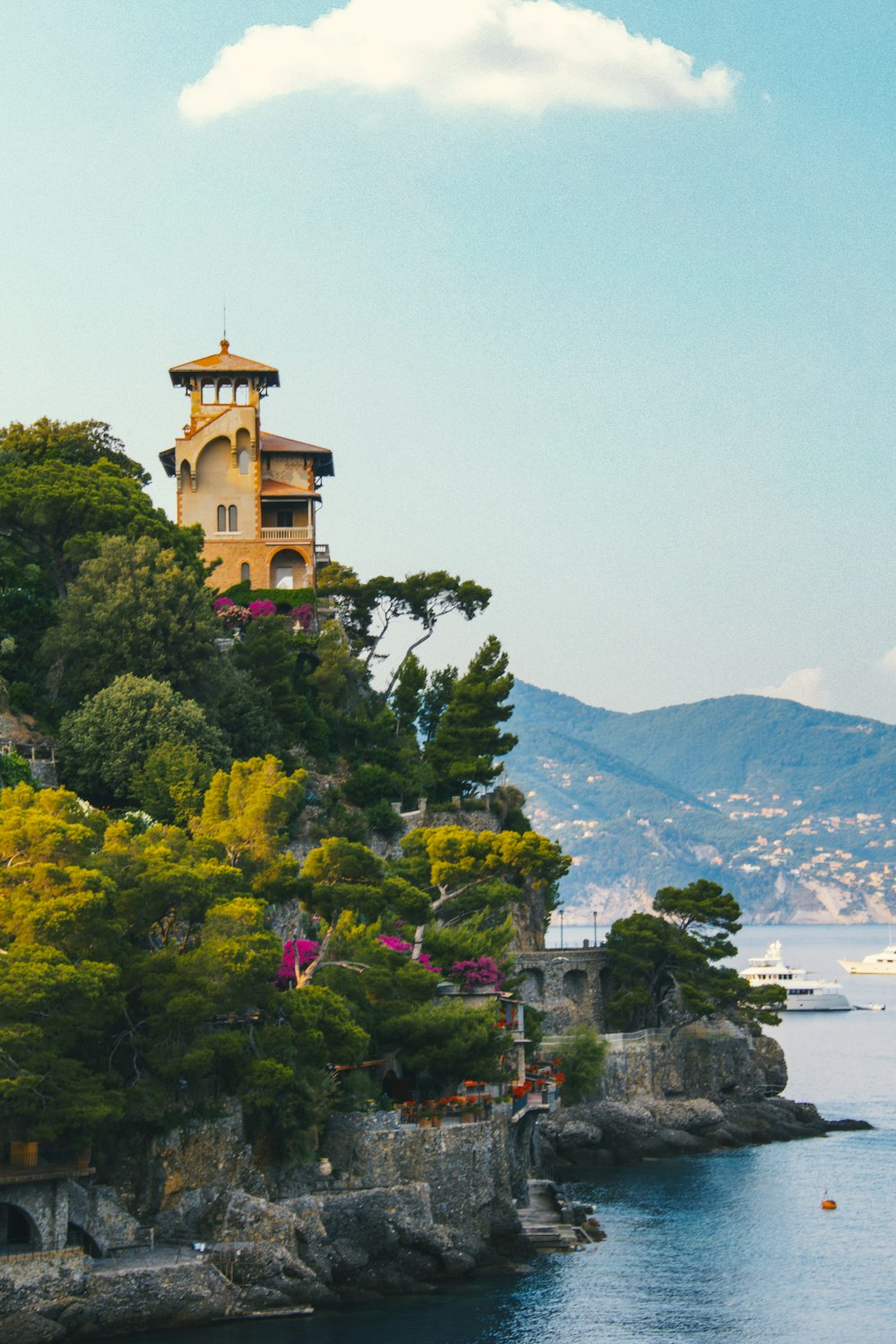 a house on a cliff overlooking the water