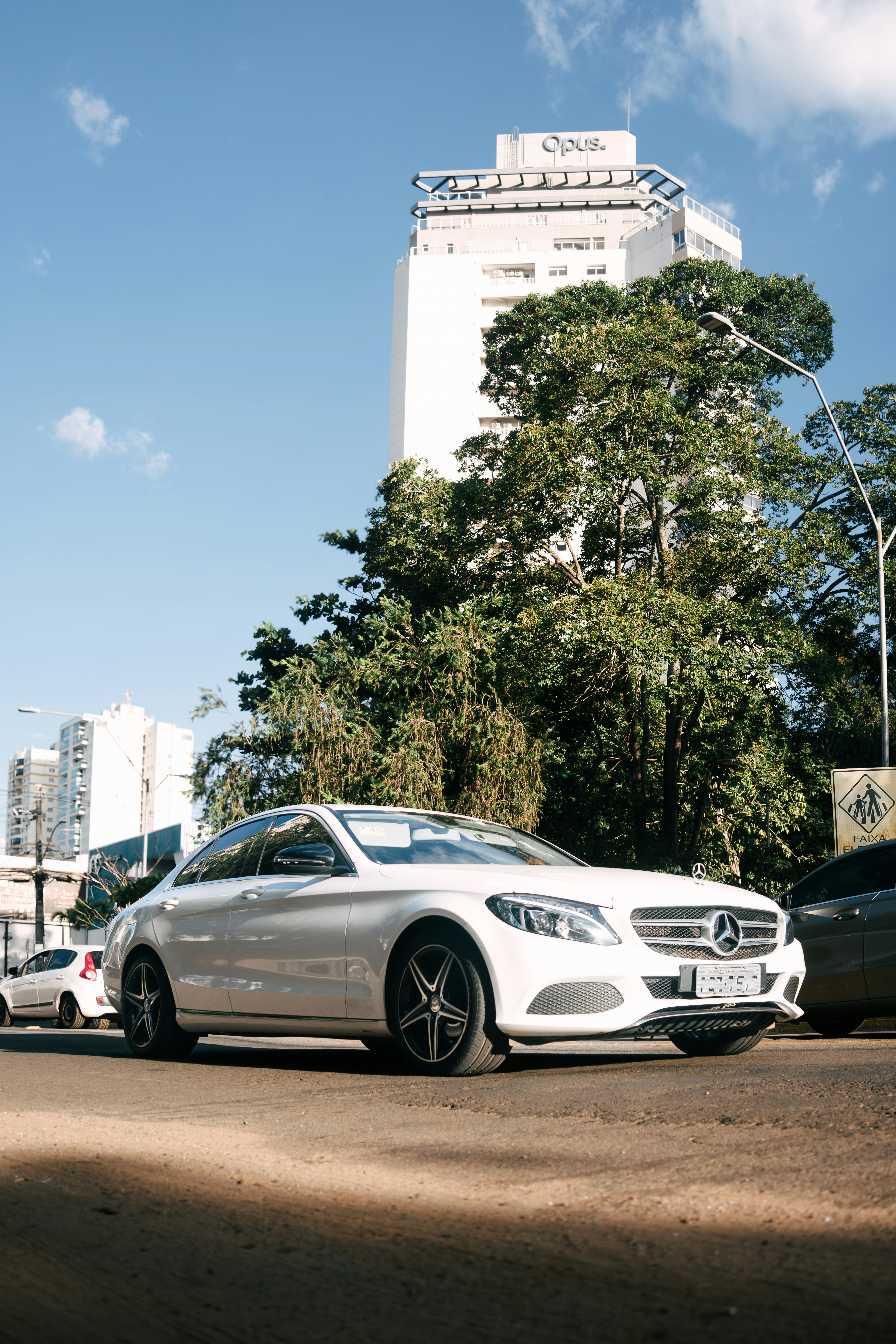 A white car parked on the side of the road photo – Free Car Image on ...