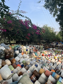 Brightly painted pottery arranged in an outdoor market setting