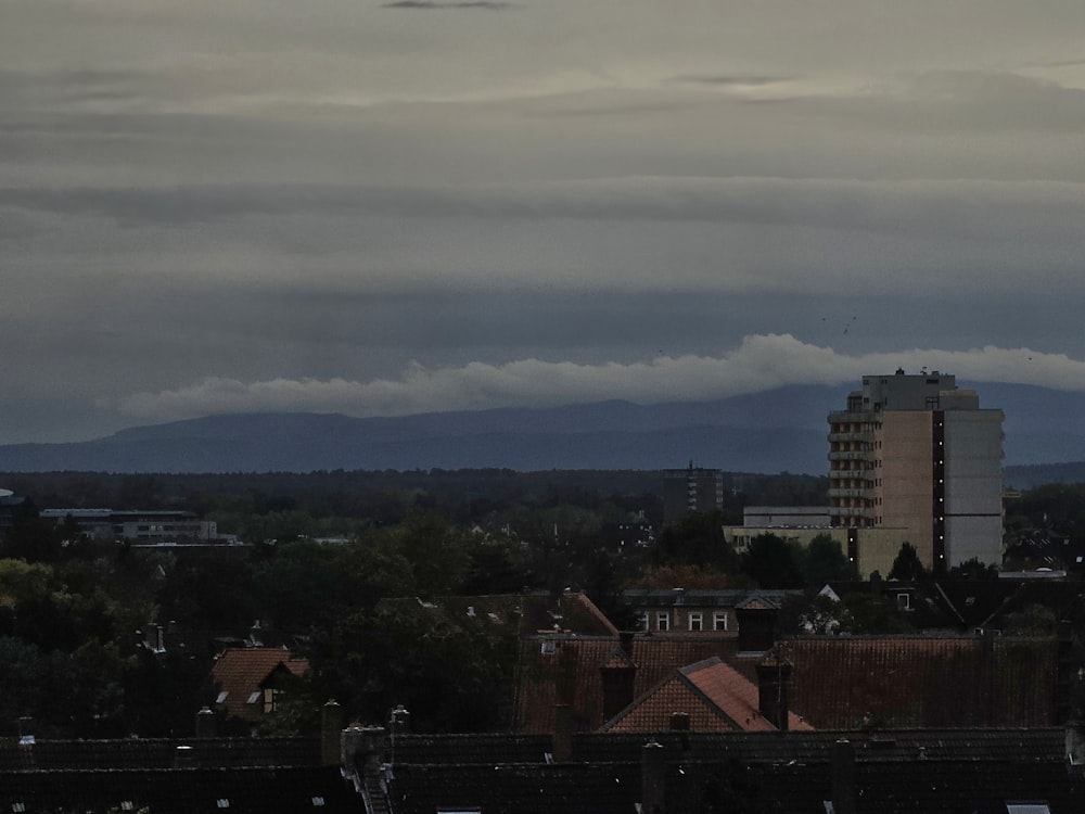 a view of a city with mountains in the background