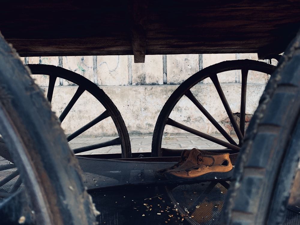 a close up of two old wooden wheels