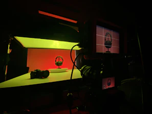An artistic shot of a streaming setup with headphones, a tablet showing the fluxoviva platform, and ambient lighting.