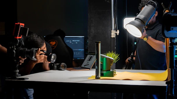 a man taking a picture of a green plant
