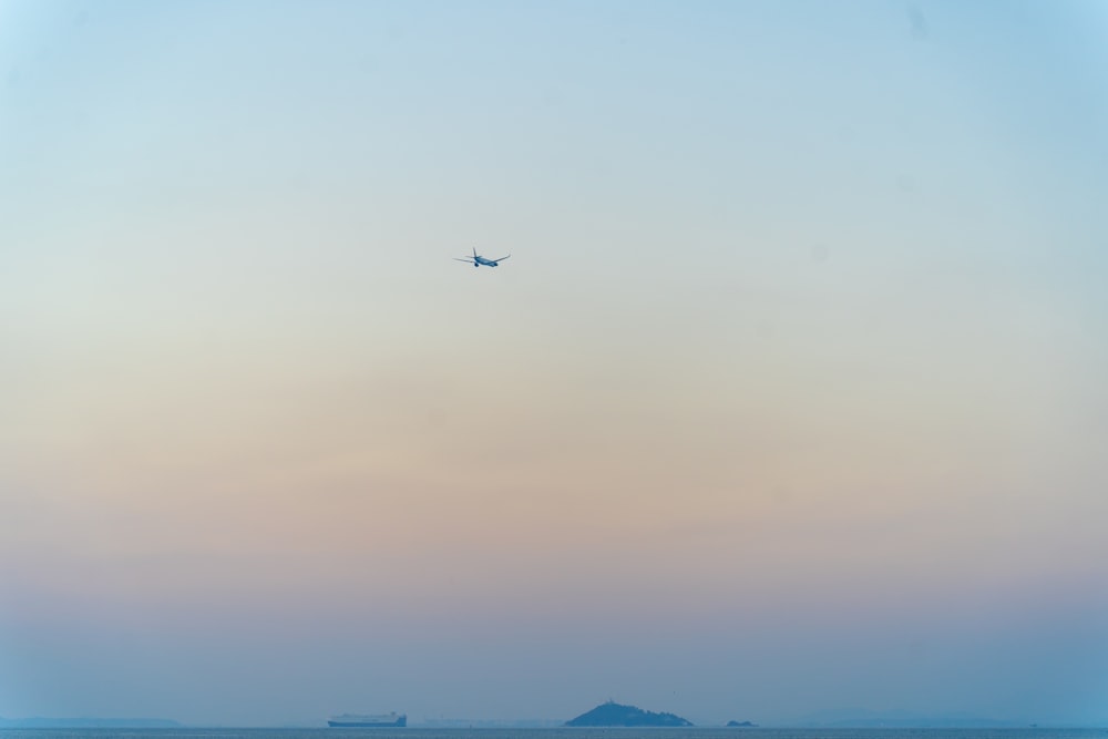 a plane flying over a body of water