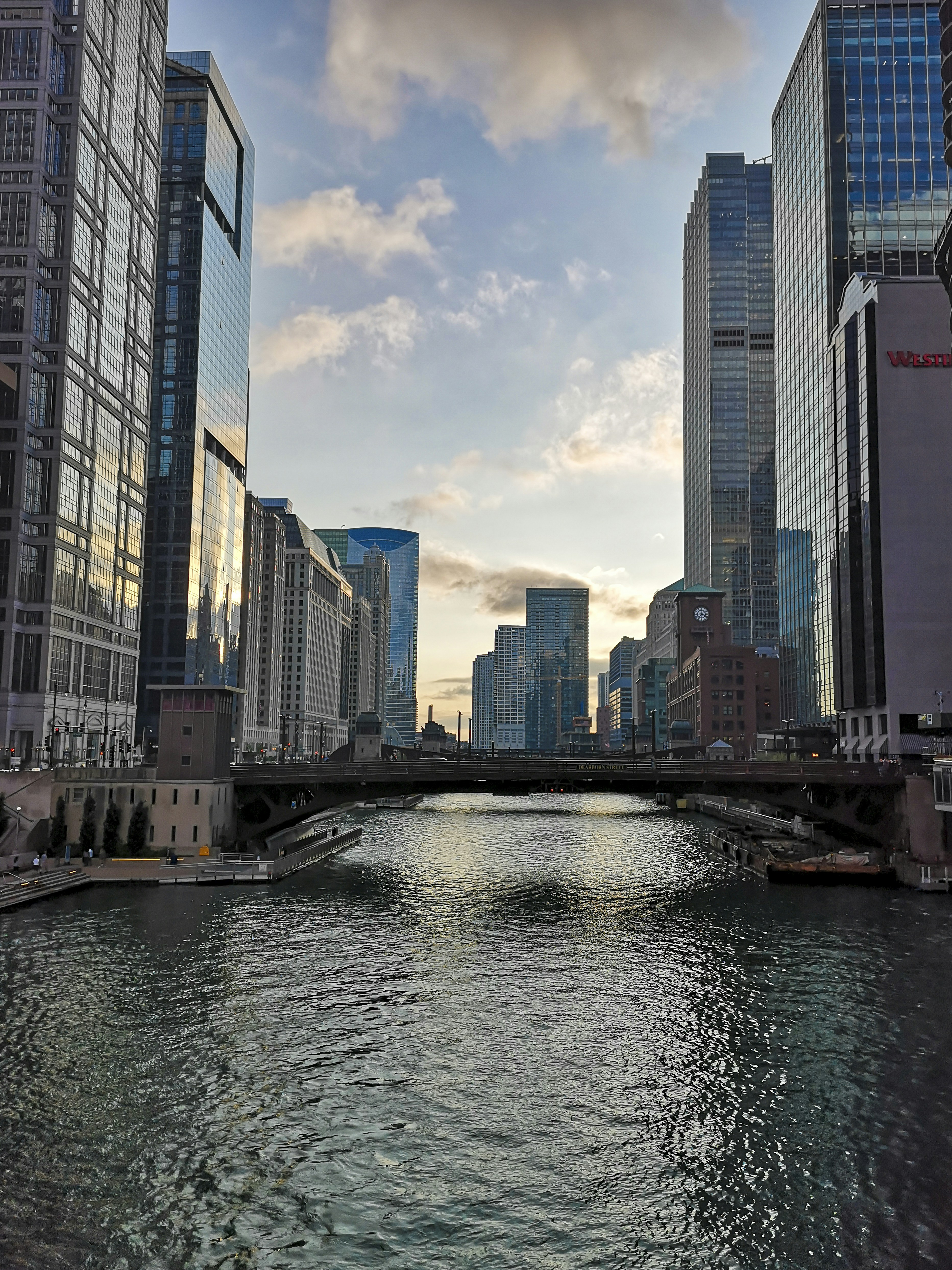 a river running through a city next to tall buildings