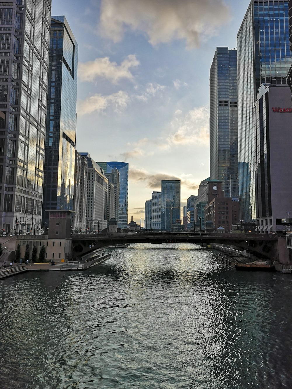 a river running through a city next to tall buildings