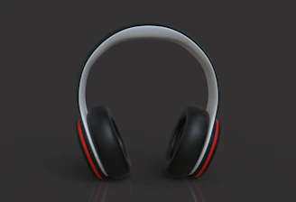 A stylish pair of headphones resting on a light gray background.