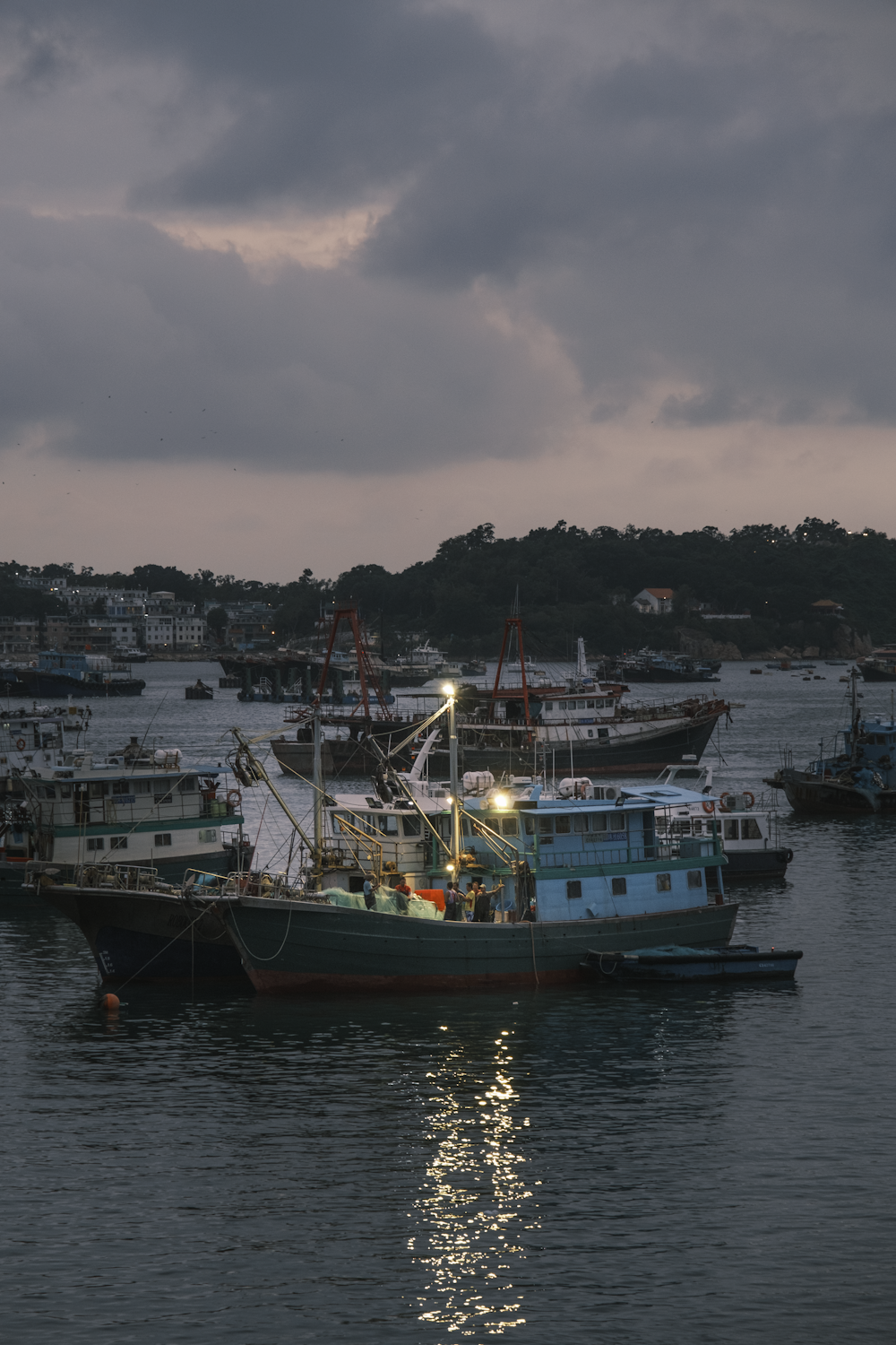 a group of boats floating on top of a body of water