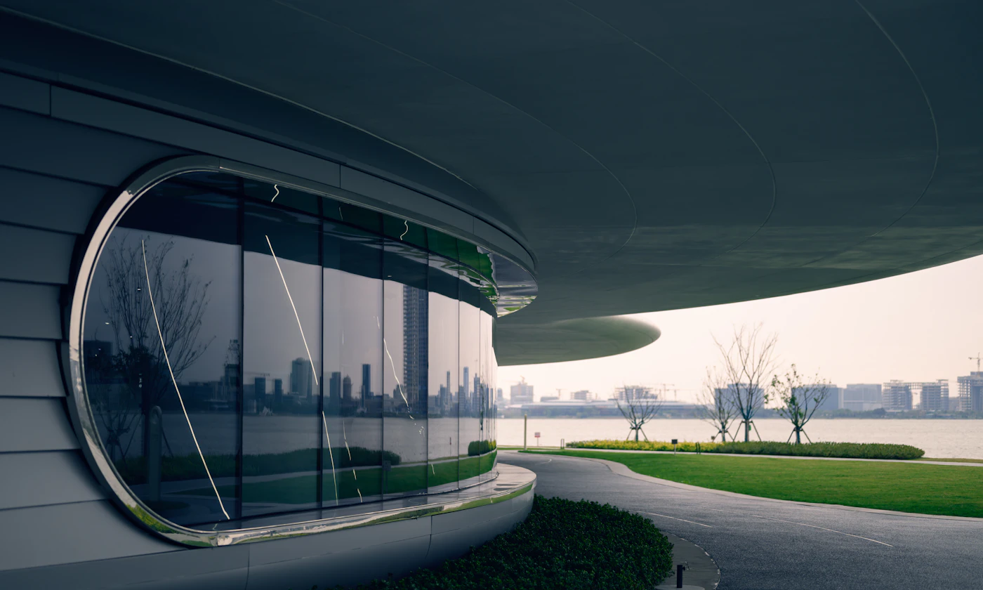 Full-height glass wall framing a landscape view