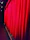 Close-up of elegant flame-retardant curtains hanging in a theater setting.