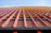 Close-up of fiber cement panels installed on a modern multifamily building exterior.