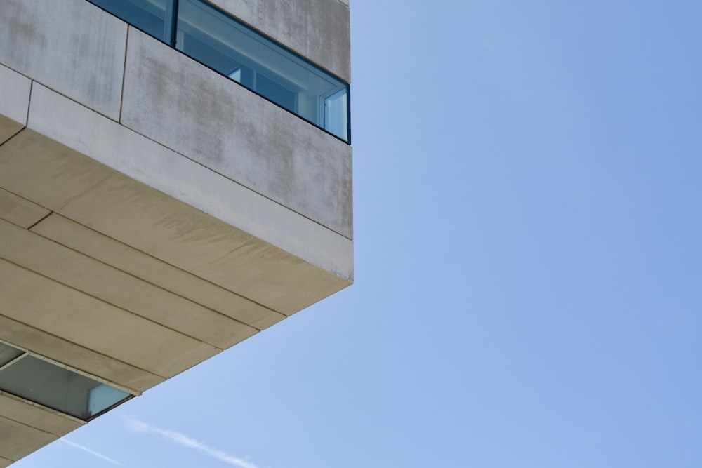 a tall building with a sky background