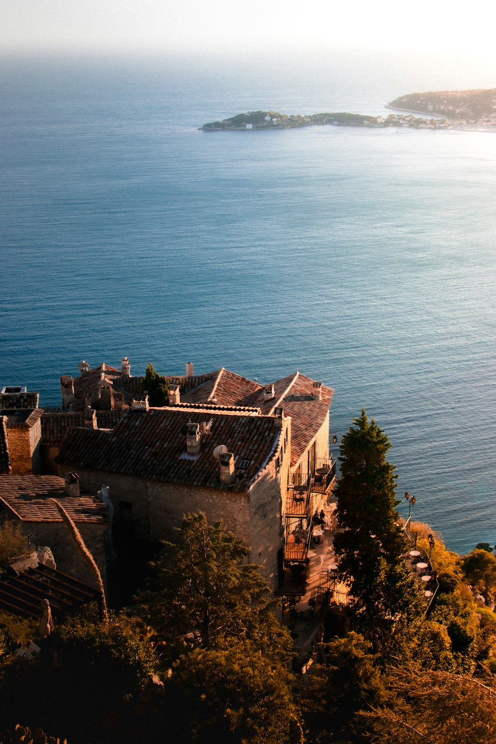 an aerial view of a building near the ocean