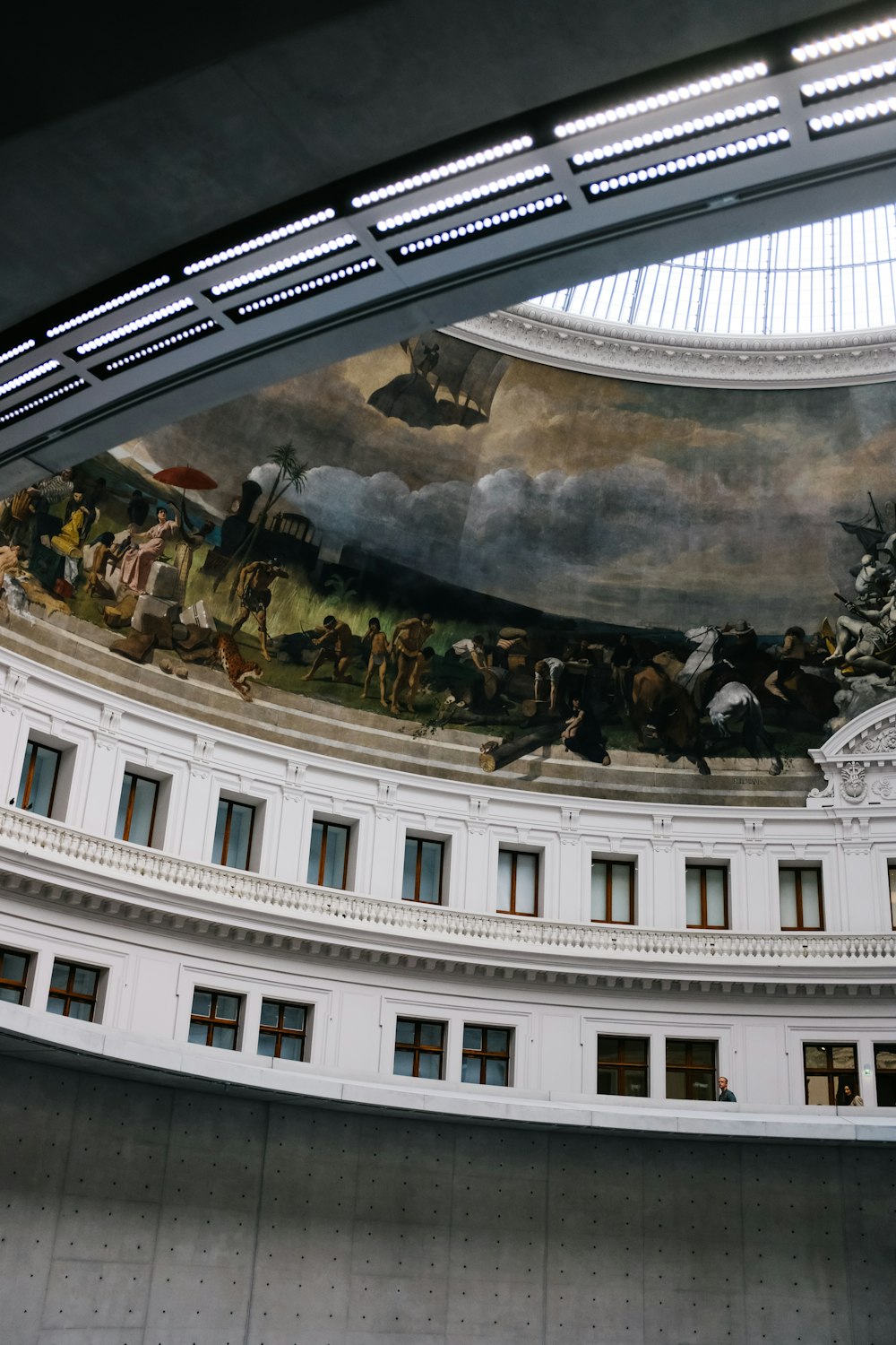 the ceiling of a building with a painting on it