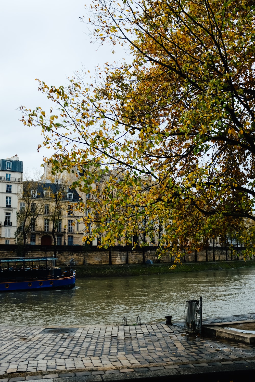 a boat on a river next to a building