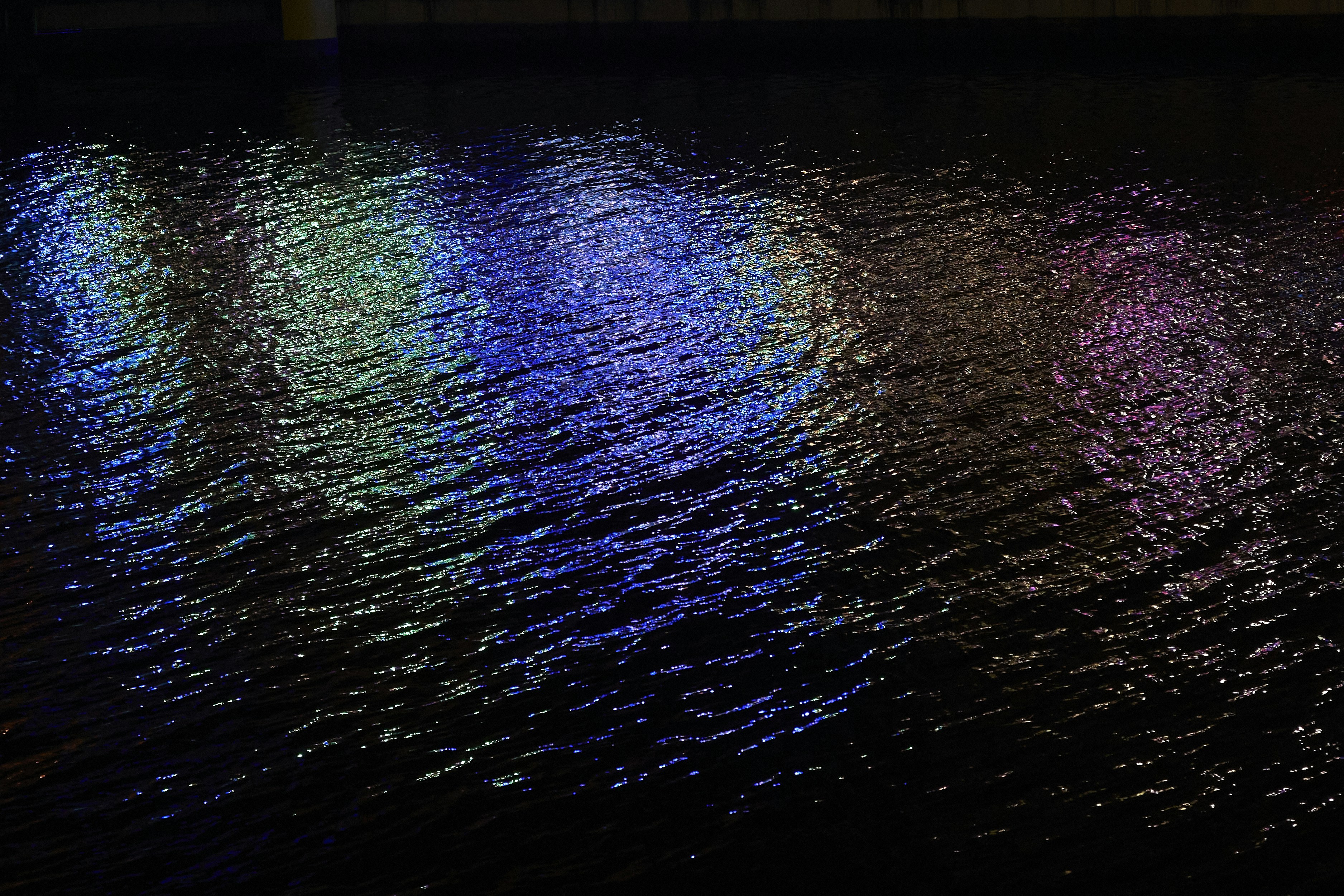 a body of water that has some lights on it