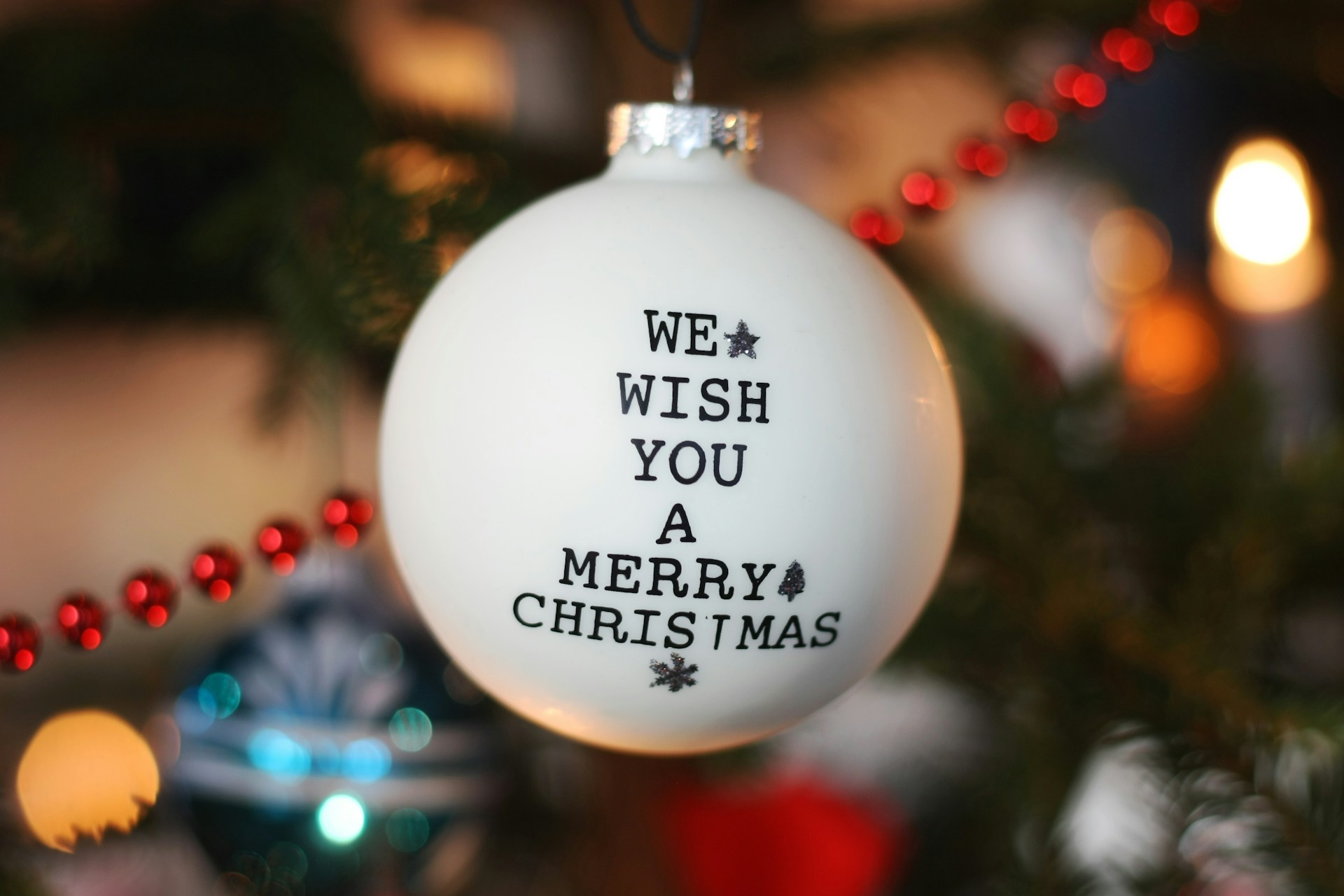 a christmas ornament hanging from a christmas tree