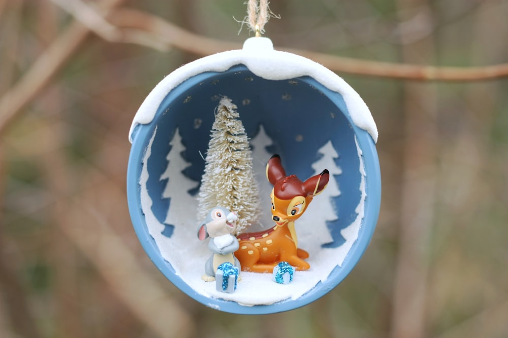 a christmas ornament hanging from a tree