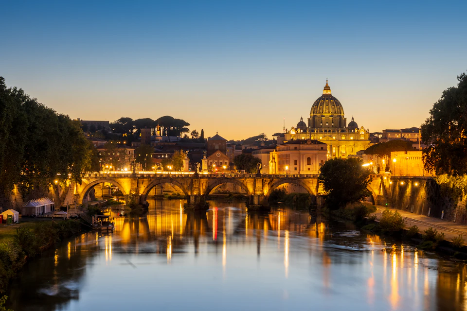 Saint Peter’s Basilica and reflections on the Tiber at sunset, Rome