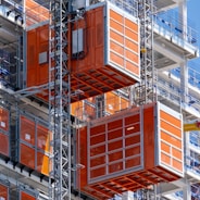 a very tall orange building with lots of windows