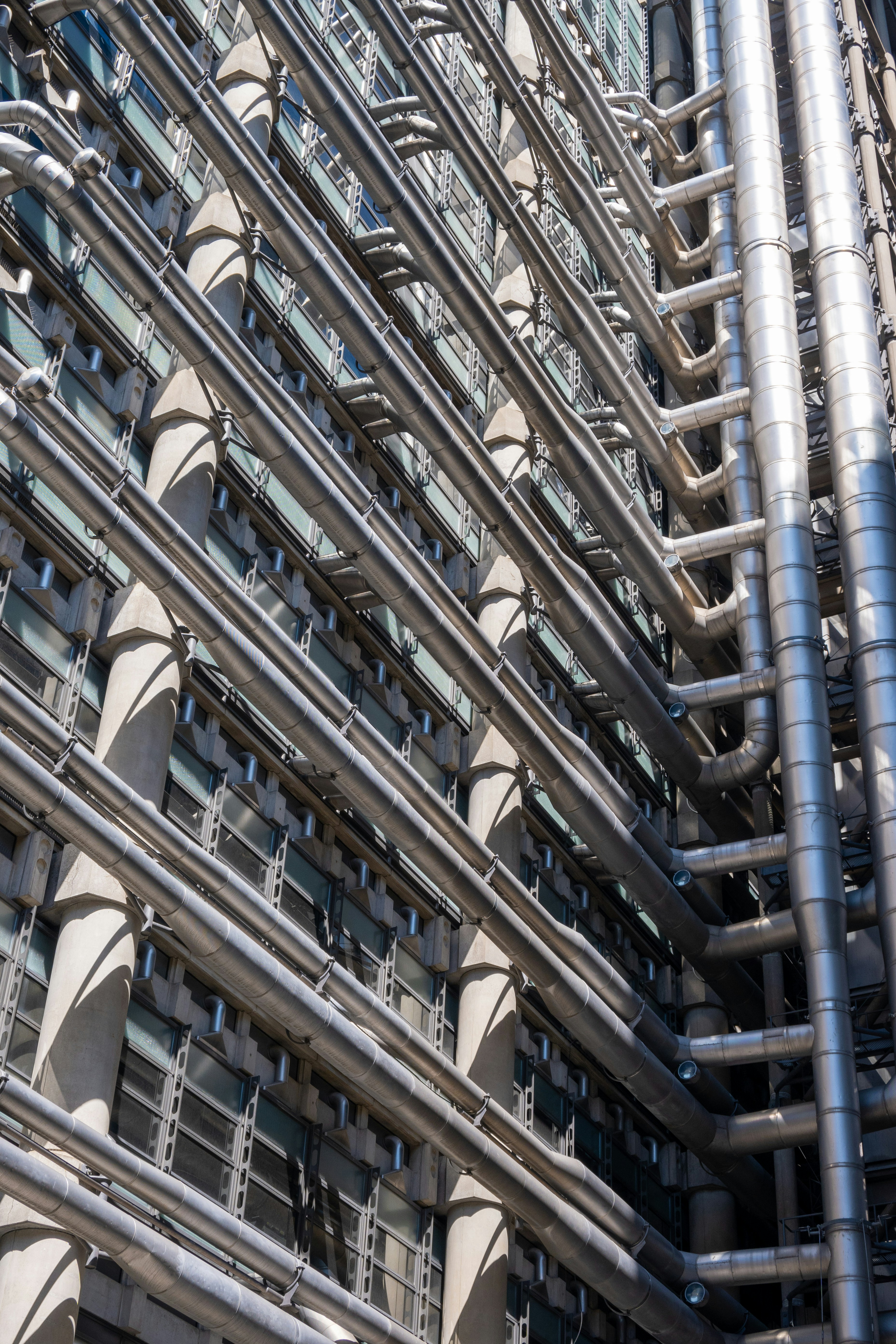 a very tall building with lots of metal pipes