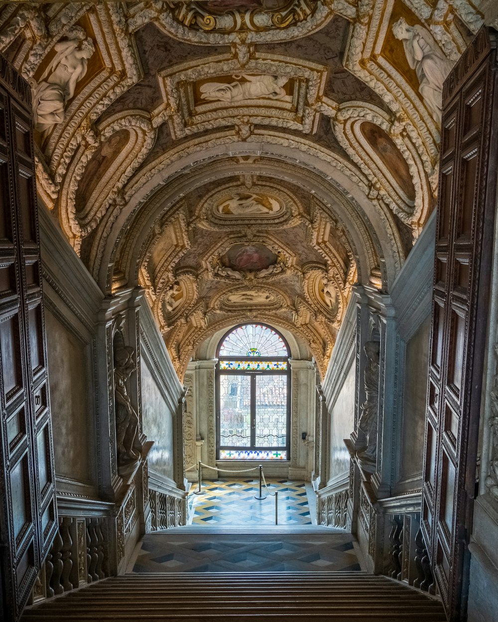 a staircase leading up to a window in a building